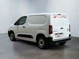 a picture of a white van parked in a room