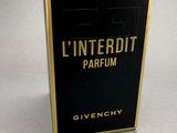 a close up of a box of perfume on a table