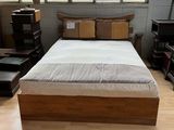 a bed that is in a room with a window