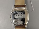 an image of a close up of a wrist watch on a table