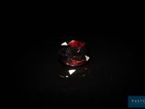 gros plan d'un diamant rouge sur une surface noire