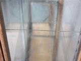 an image of a glass display case in a room