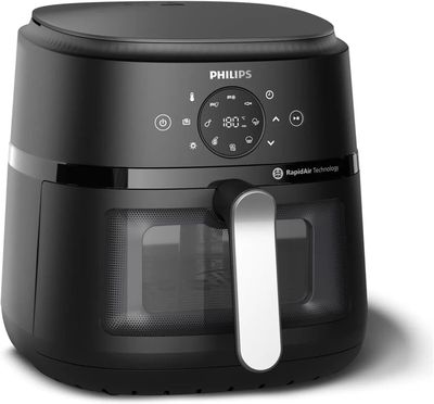 La friteuse à air chaud Philips est noire et dotée d'une poignée blanche.