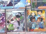 a lot of different pokemon cards on the table