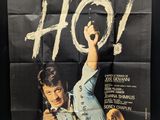 a movie poster of a man holding a gun in his hand