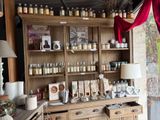 a large wooden cabinet with many jars on it