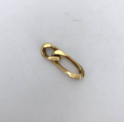 a close up of a gold ring on a white surface