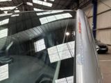 a reflection of a car in the rear window of a car