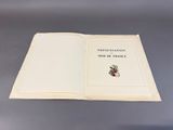 an open book with a picture of a man riding a bike