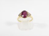 an oval ruby and diamond ring
