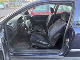 the interior of a car with the door open and the seat up