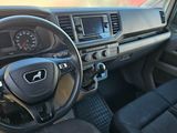 the interior of a car with a steering wheel and dashboard controls