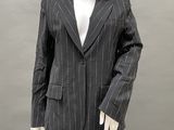 a mannequin wearing a black and white pinstripe suit