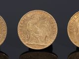three gold sovereigns, one of which is a sovereign and one of which is a sovereign