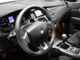 a steering wheel and dashboard of a car in a car showroom