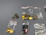 a lot of coins and other items that are on the table