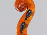 an old violin with a wooden back and a black bow