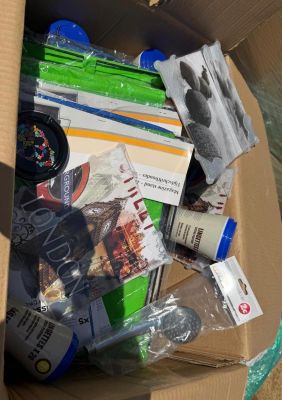 a cardboard box full of items that are sitting on the floor