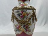 a vase that is sitting on a white surface