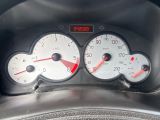 a close up of a speedometer and gauges in a car
