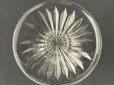a glass bowl with a flower inside of it