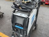 a machine that is sitting on the ground in the parking lot