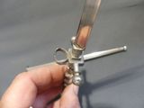a person holding a pair of scissors in their hand