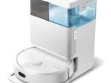 un distributeur d'eau blanc et bleu posé sur un plan de travail