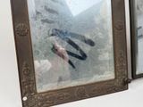 a picture of a person taking a picture of themselves in a mirror