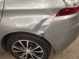 a close up of a car that has a denting on it