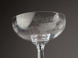 a wine glass that is sitting on a table