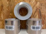 three rolls of duct tape sitting on top of a table