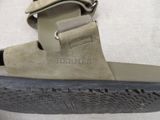 a close up of a pair of sandals on a white surface
