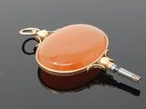 an image of a carneline pendant on a black surface