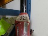 a fire hydrant with a number on it next to a shelf