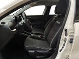 the interior of a white car with black seats and a steering wheel