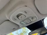 a view of the inside of a car from the driver ' s seat