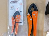 a pair of pliers and a pair of pliers sitting on a table