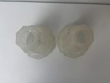 two plastic cups sitting on top of a white counter