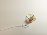 a ring that is sitting on top of a piece of paper
