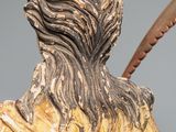 statue of a man with a feather in his hand