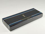 a black box with a blue stripe and a gold logo on it