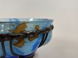 a blue bowl sitting on top of a white table