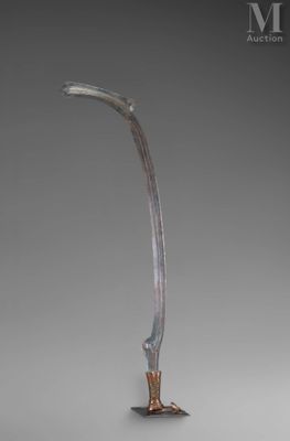 a close up of a metal object on a gray surface