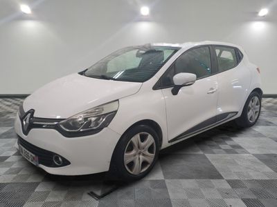the white car is parked on a checkered floor in the garage