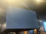 a large screen in the middle of a room
