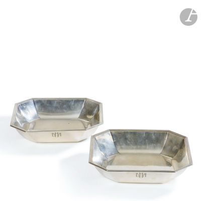 pair of silver plated dishes with engraved numbers on each side