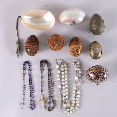 various shells and beads are arranged on a white surface