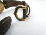 an image of a close up of a wrist with a buckle on it