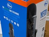 a box with a microphone inside of it on a shelf